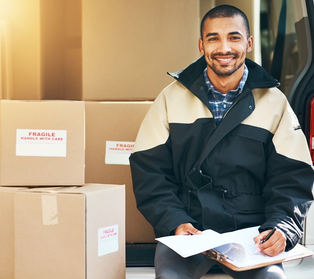 Smile,,Delivery,Man,And,Clipboard,In,Portrait,With,Cardboard,Boxes